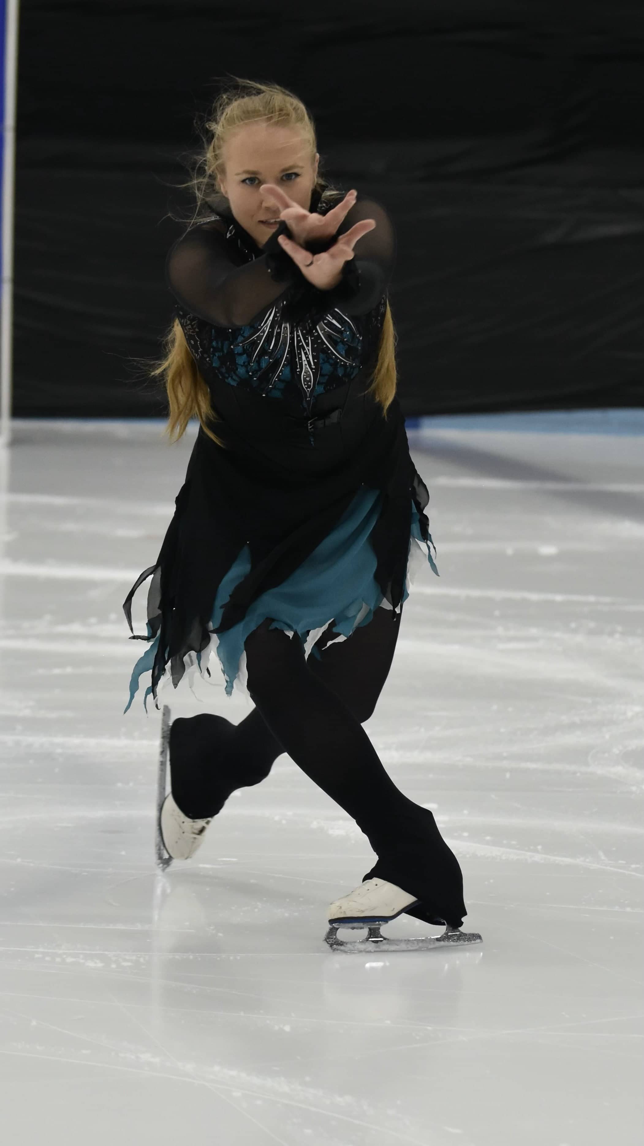 Stephanie Kazior, with hands open and extended, performs a mesmerizing program. 