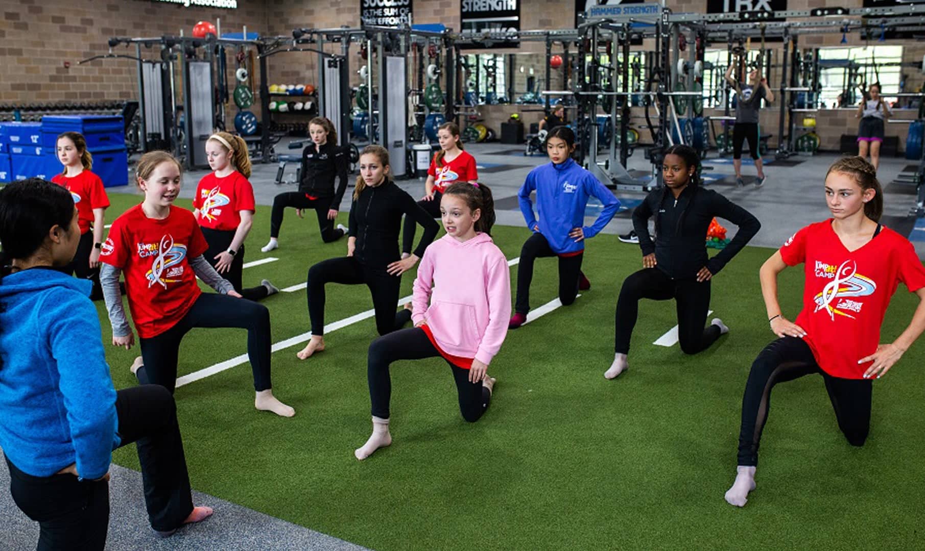 Athletes wait for instruction at a figure skating training camp.